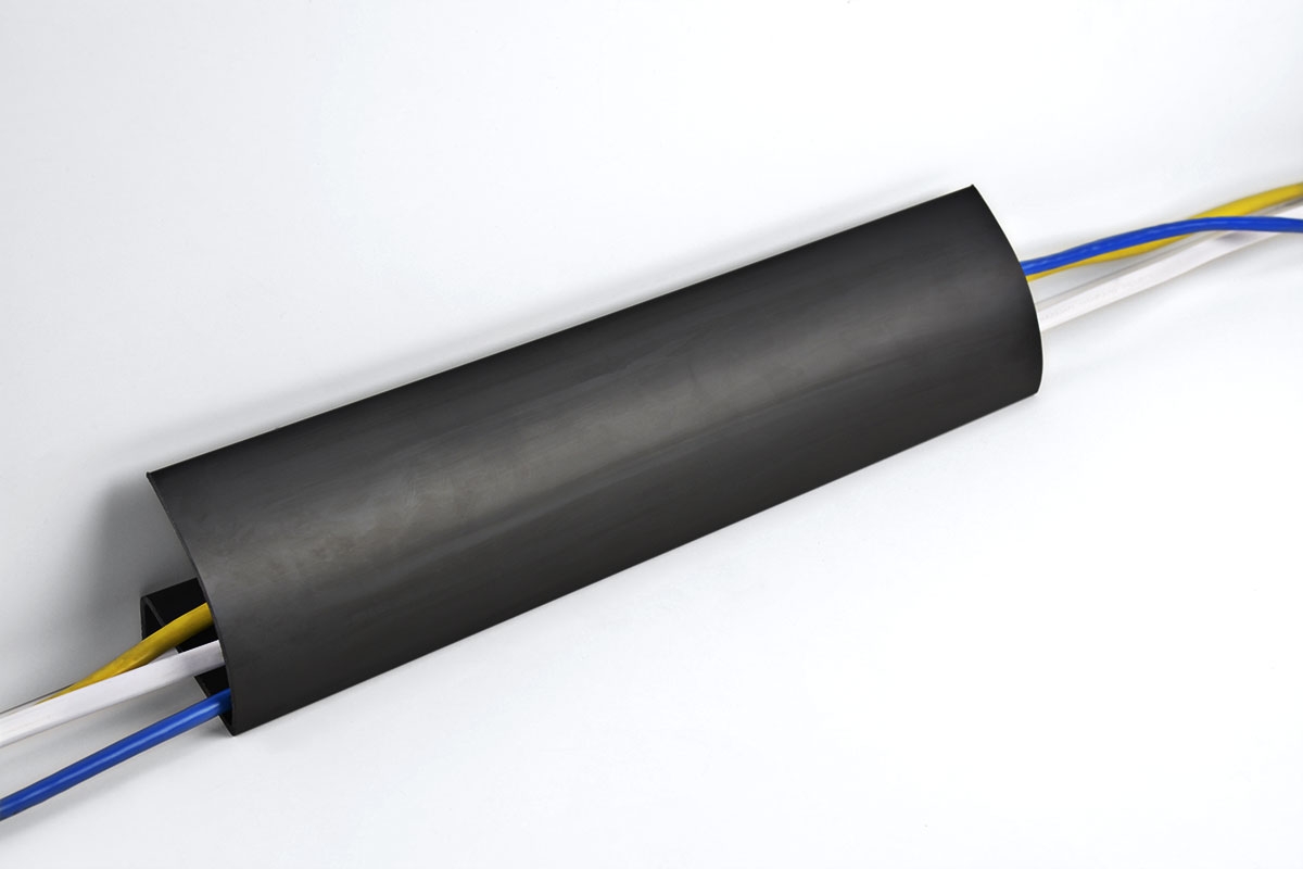 How does the cable manager help keep cables out of sight?