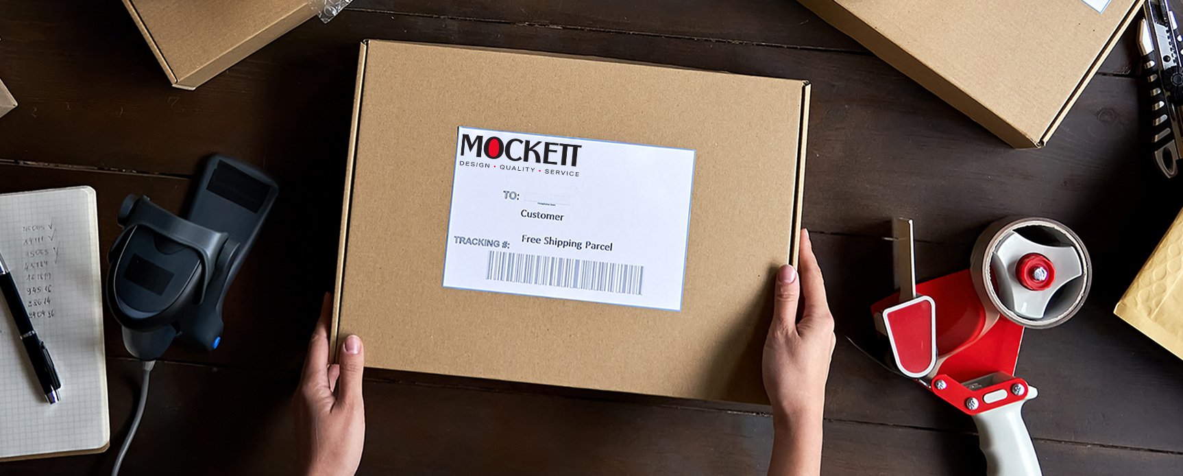 Mockett shipping parcel being packed for delivery